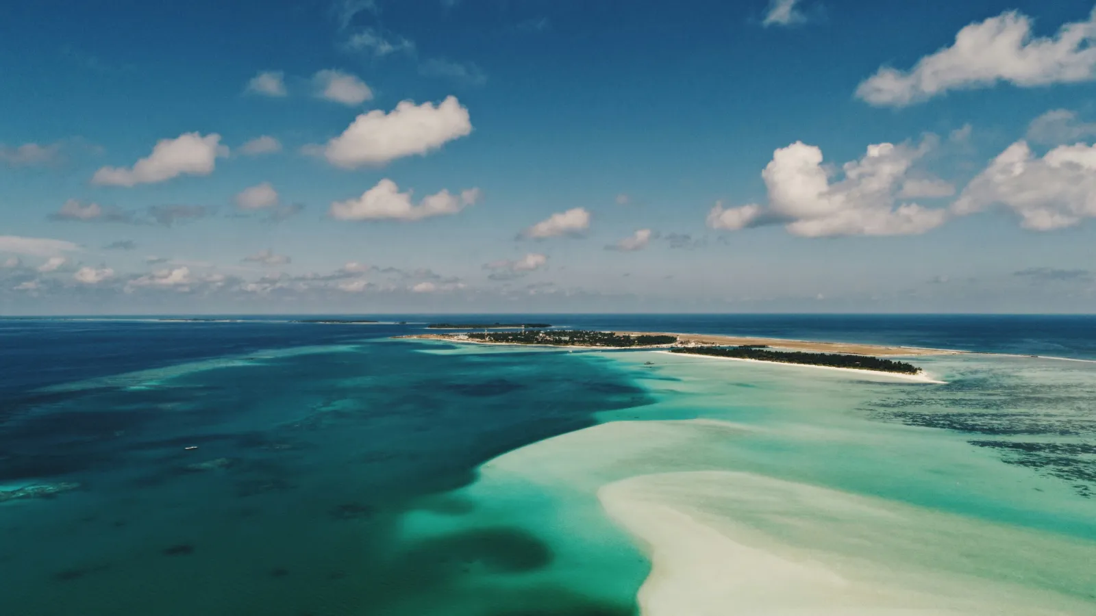 Sandbanks and shallow turquoise water around a resort island in Alif Dhaal Atoll, Maldives