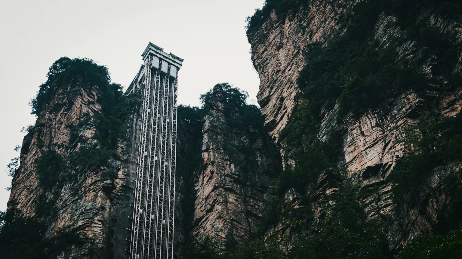 The Bailong Elevator glass lift shaft climbing a sheer sandstone cliff in Zhangjiajie