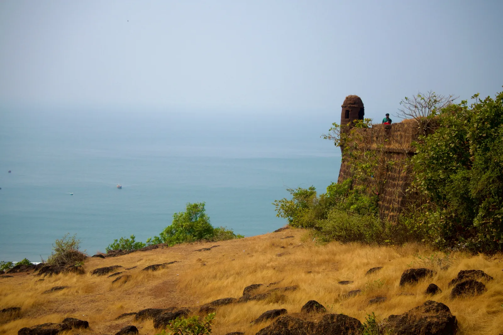 Old laterite walls of Chapora Fort above the sea near Vagator in North Goa