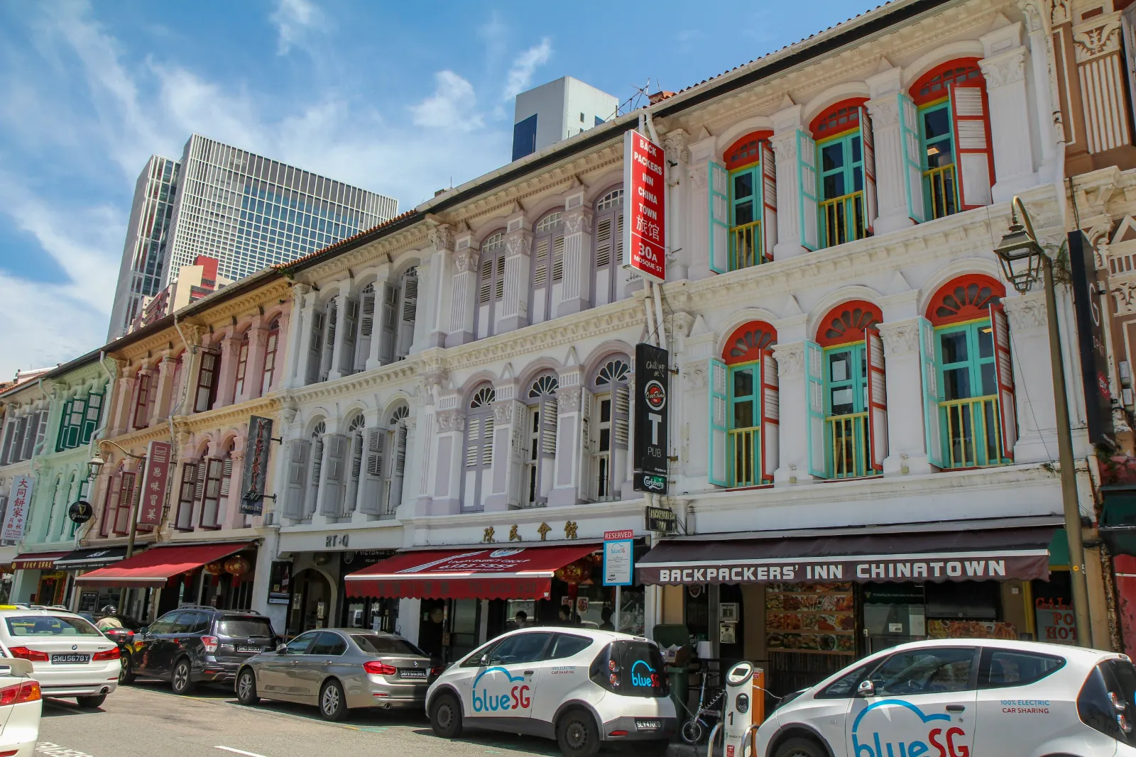 Row of restored heritage shophouses along a street in Chinatown, Singapore