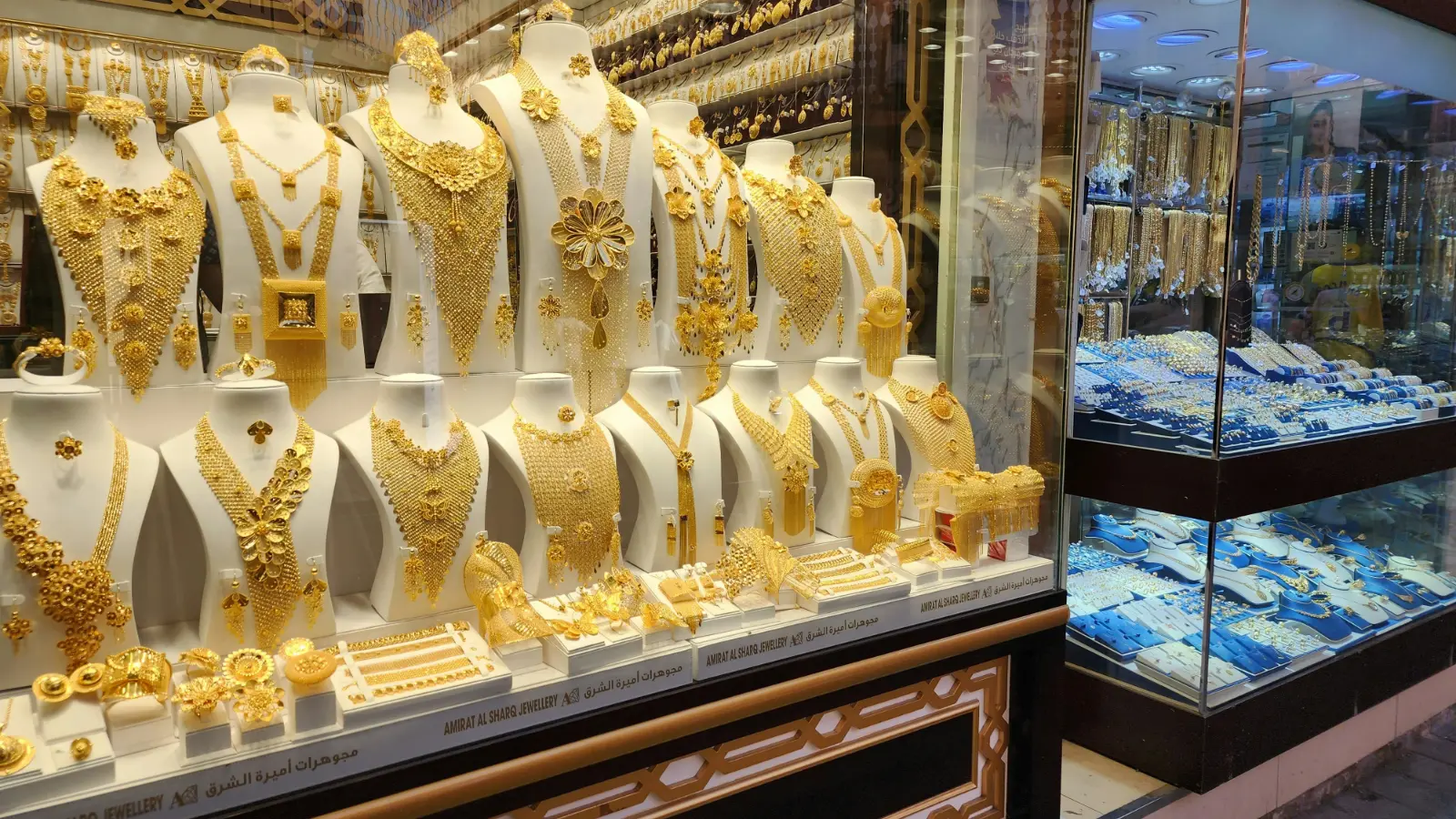 Shop window in the Dubai Gold Souk in Deira filled with heavy gold necklaces
