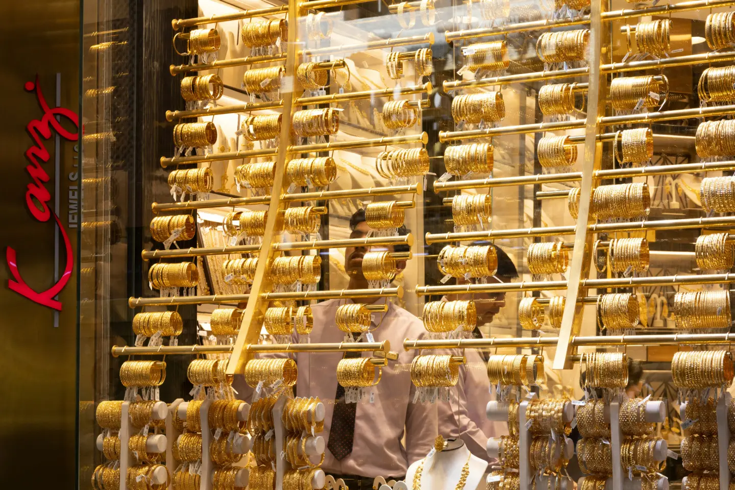 Rows of gold bracelets hanging in a Dubai jewellery store display