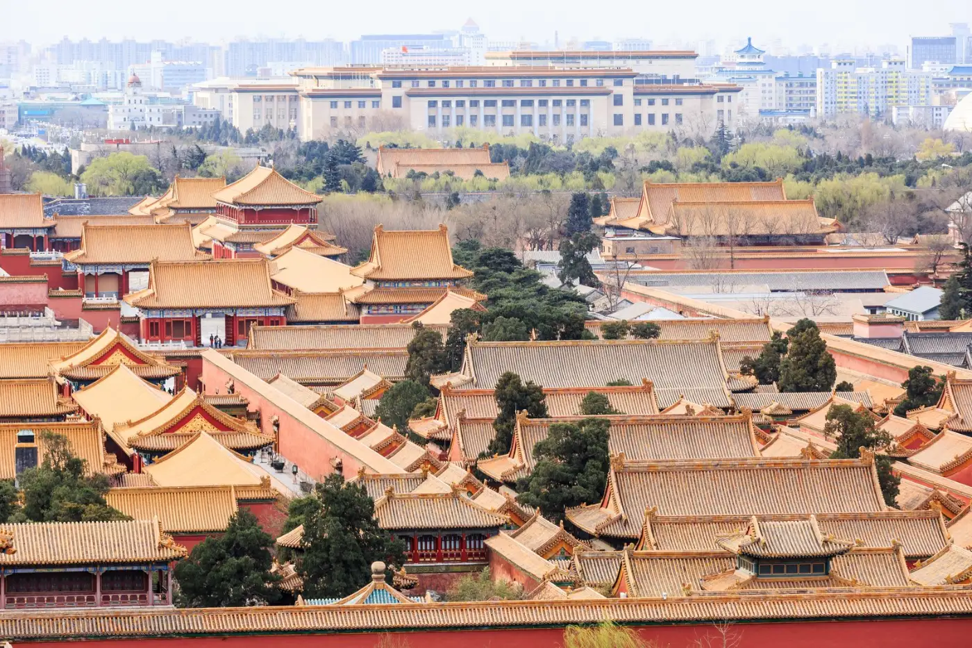 Golden roofs of the Forbidden City palace halls spreading across central Beijing seen from above
