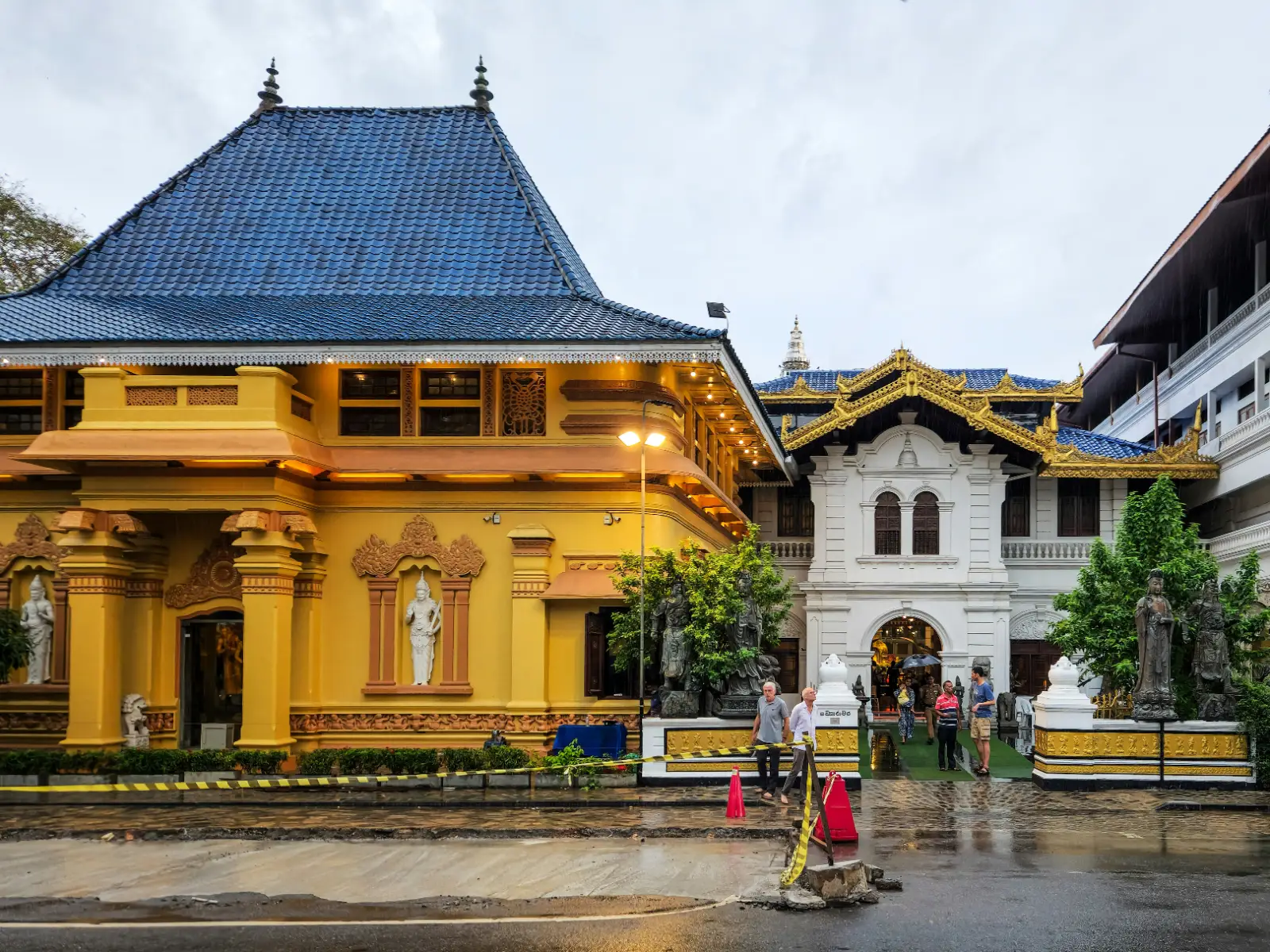 Ornate yellow and blue exterior of Gangaramaya Temple on Sri Jinarathana Road, Colombo