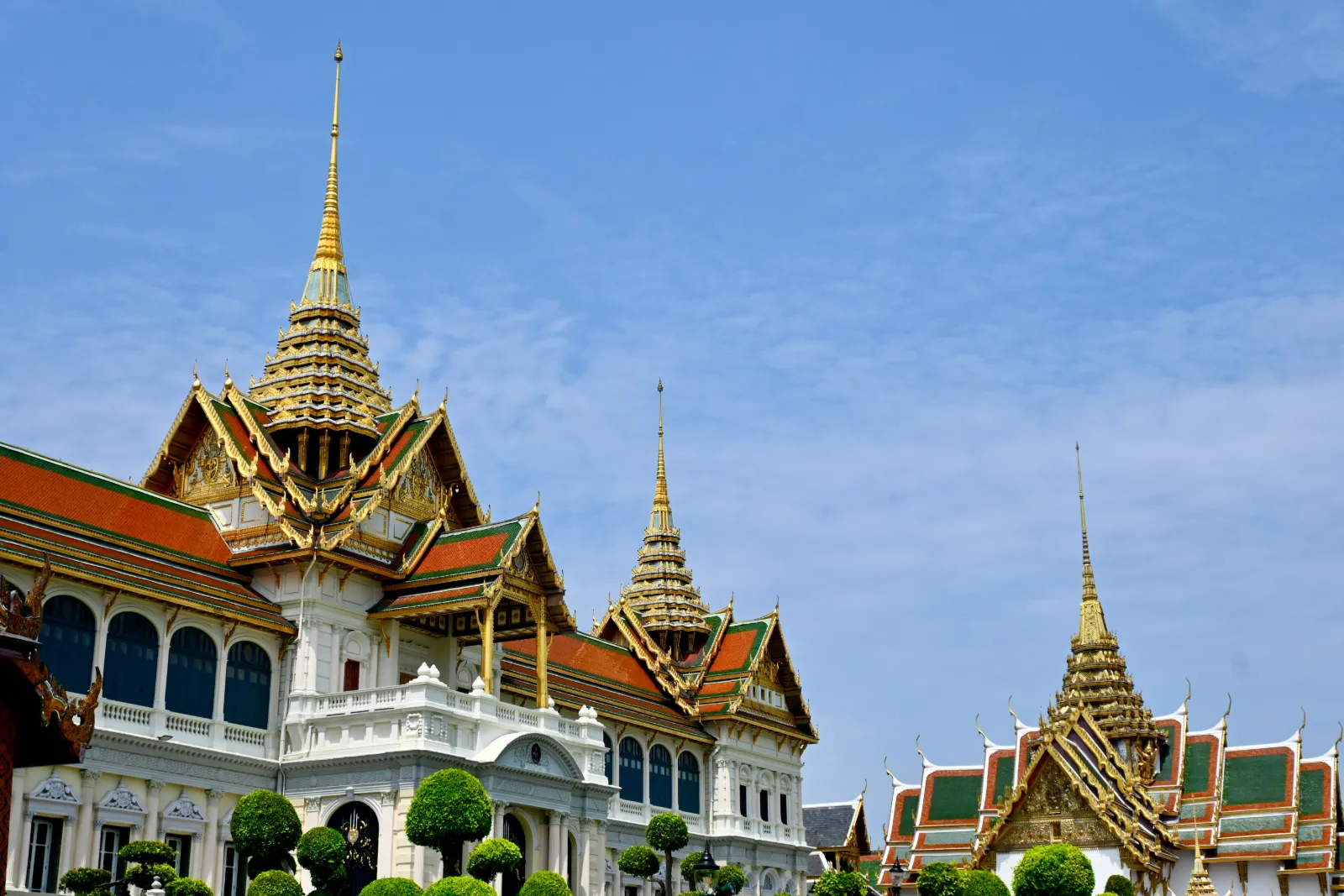 Golden spires and ornate roofs of the Grand Palace complex in Bangkok