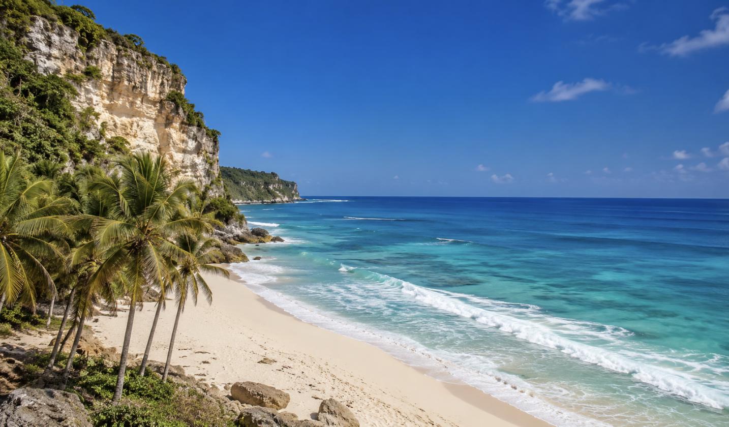 Turquoise sea and white limestone cliffs at a sunny Bali beach in Uluwatu