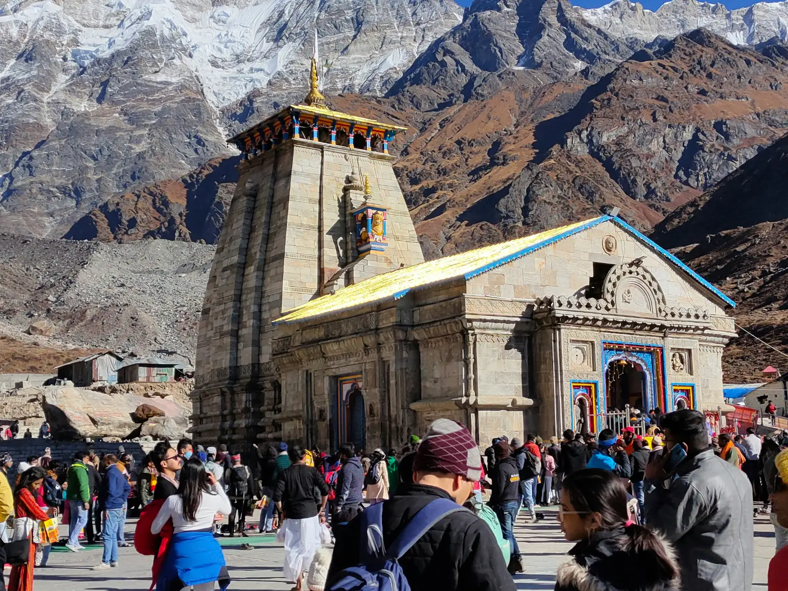 Crowd of devotees visiting the stone Kedarnath Temple high in the Garhwal Himalaya