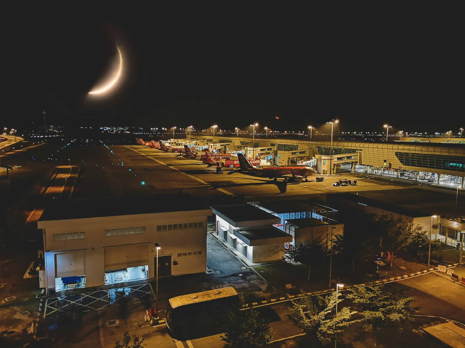 Aircraft parked at the gates of KLIA2 airport near Kuala Lumpur at night