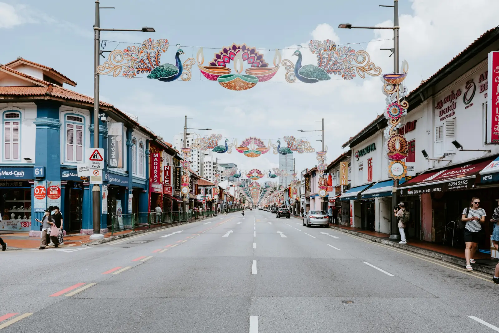 Colourful shophouses under festive street decorations along a road in Little India, Singapore