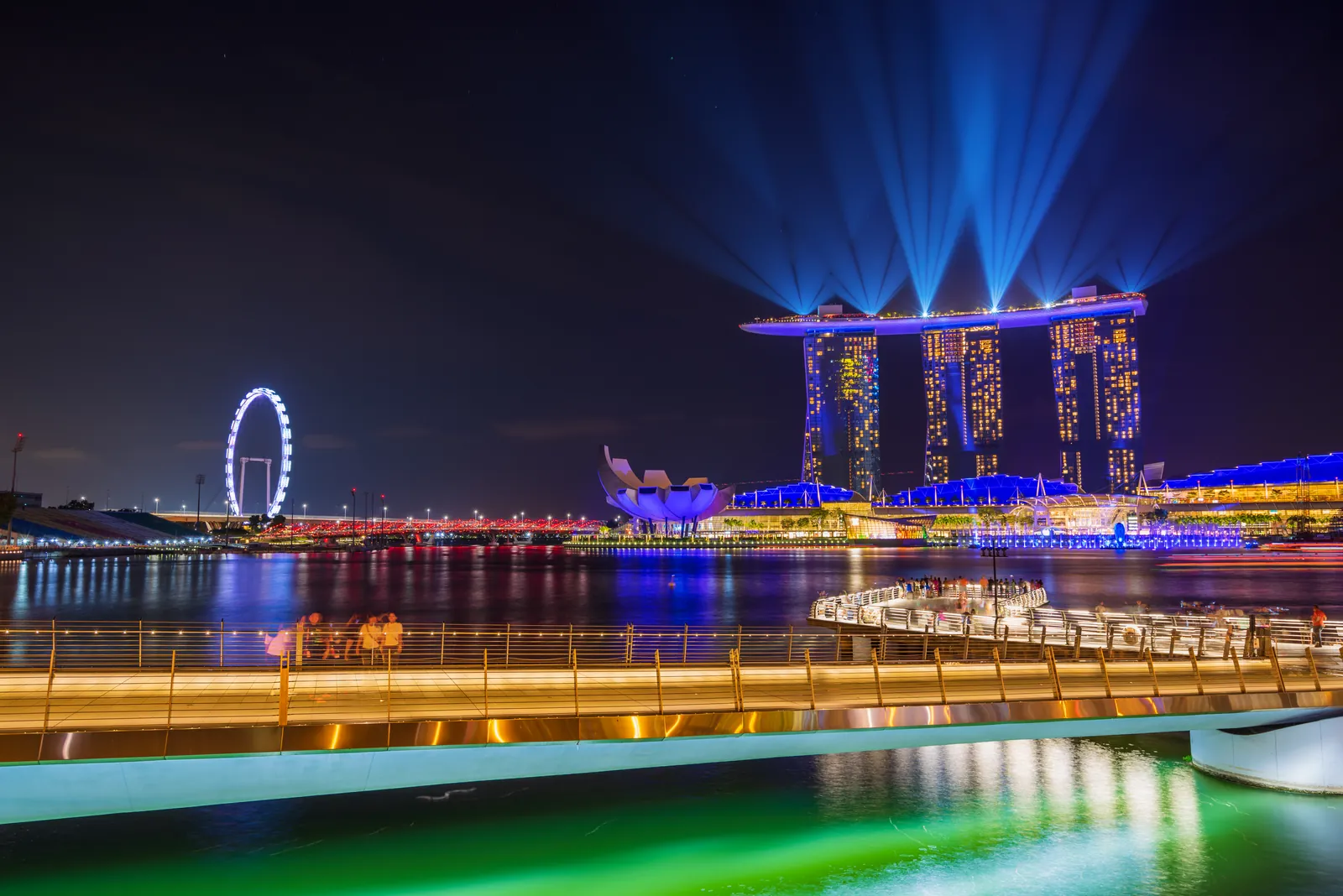 Light beams over Marina Bay Sands during the evening light and water show on Marina Bay
