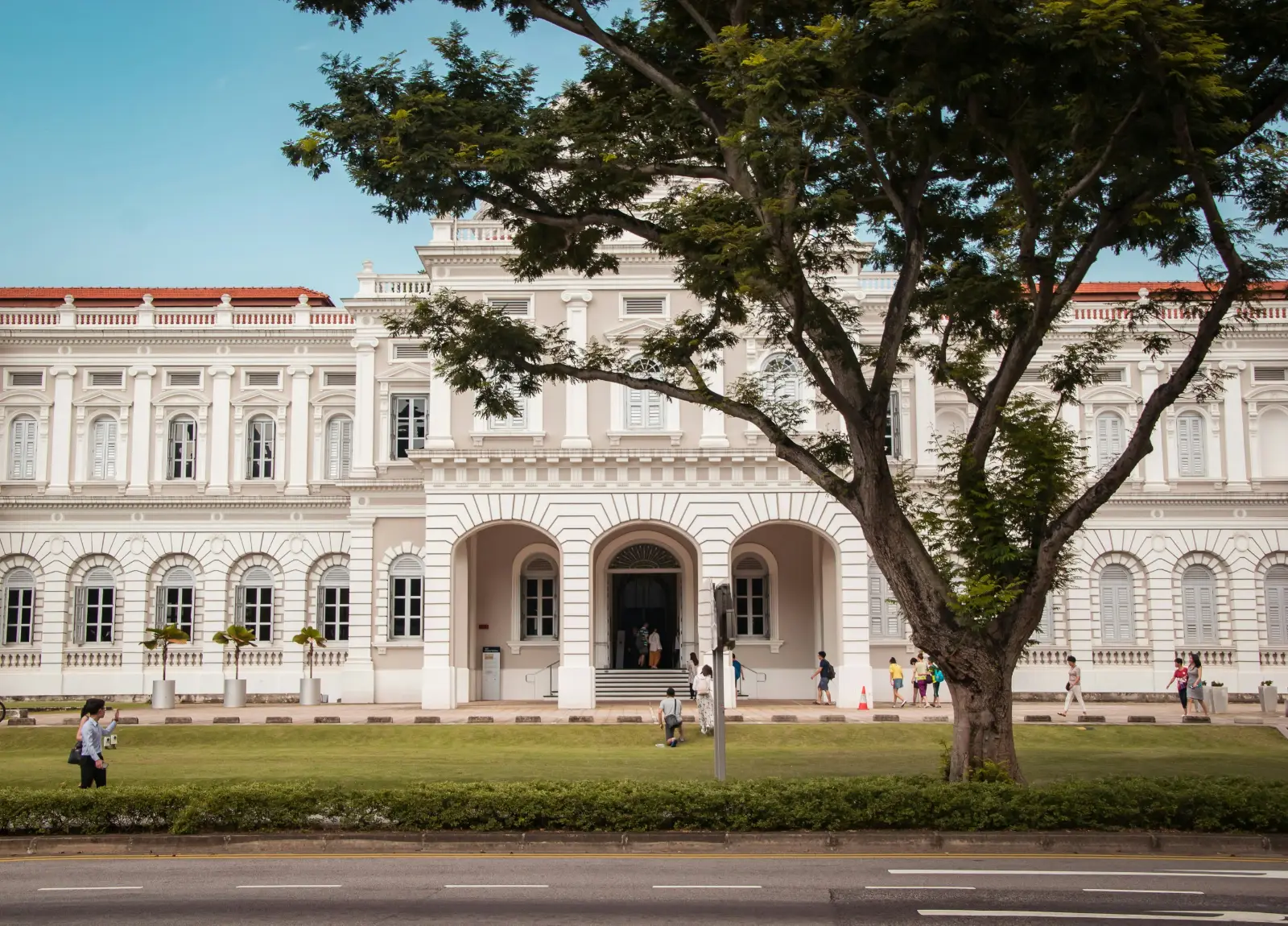 White colonial facade and dome of the National Museum of Singapore on Stamford Road
