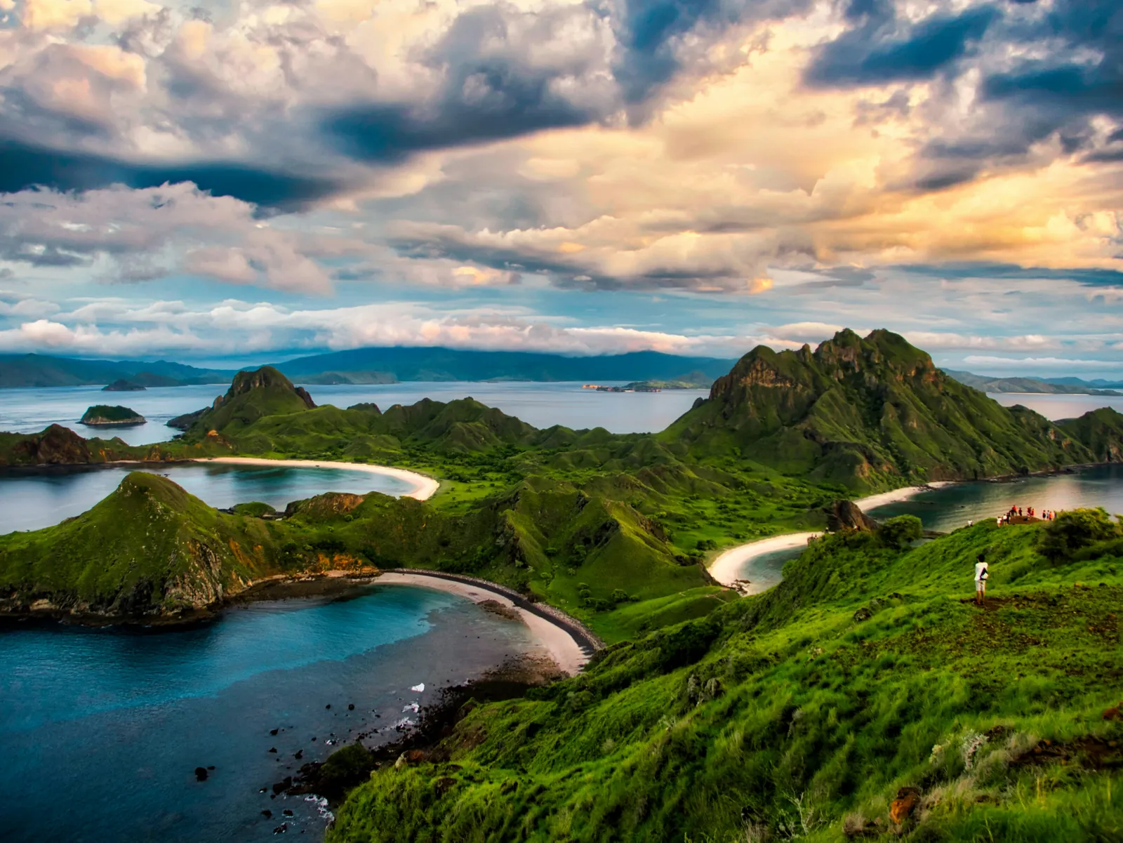 Green hills and three curved beaches of Padar Island in Komodo National Park after the rains