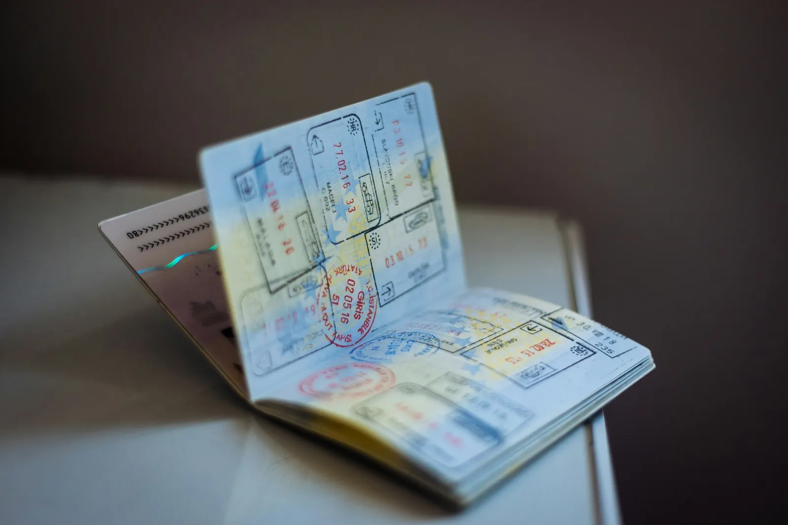 Open passport showing entry and exit stamps, a reminder to plan fares around travel dates