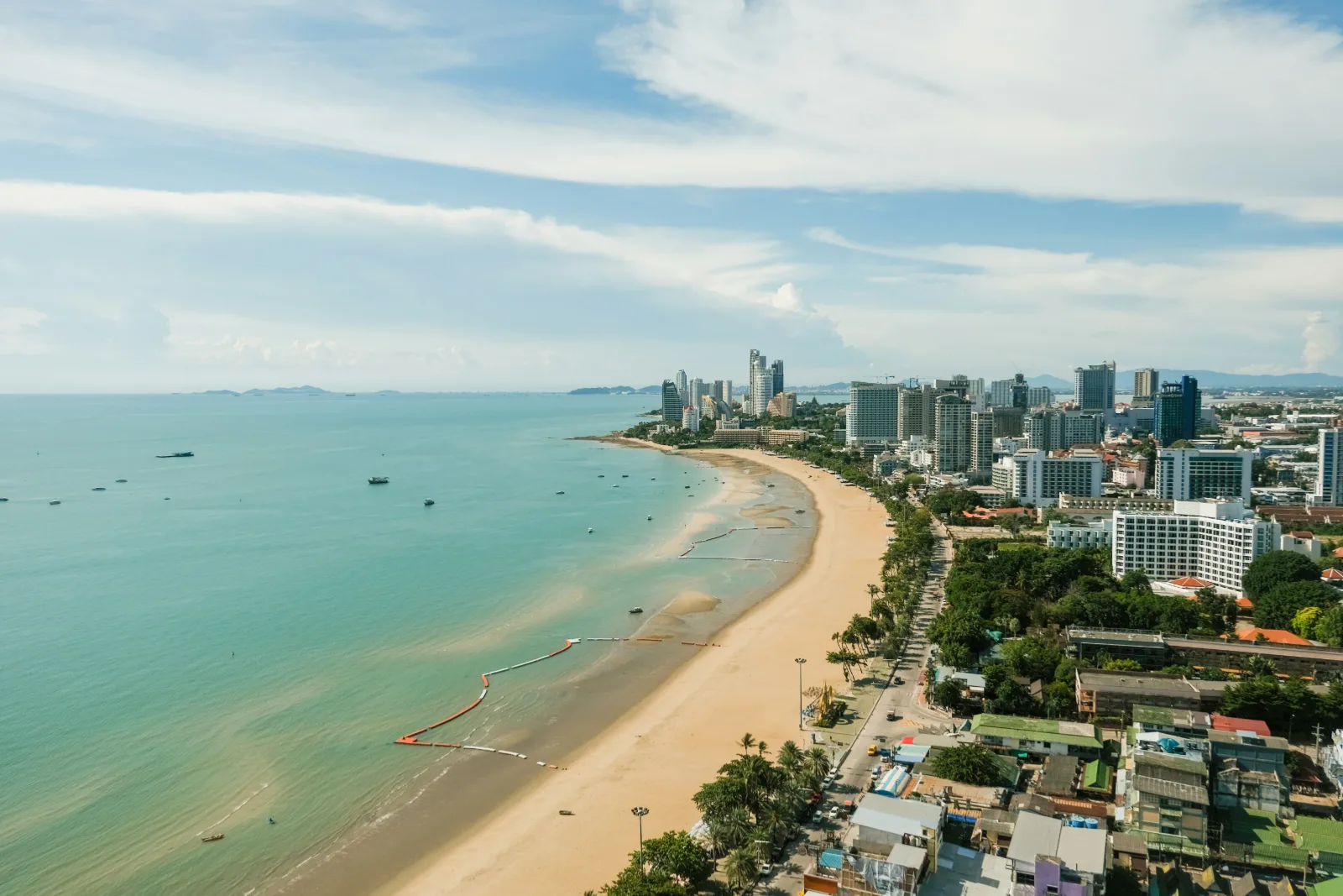 Aerial view of Pattaya city and its long curving beach along the Gulf of Thailand