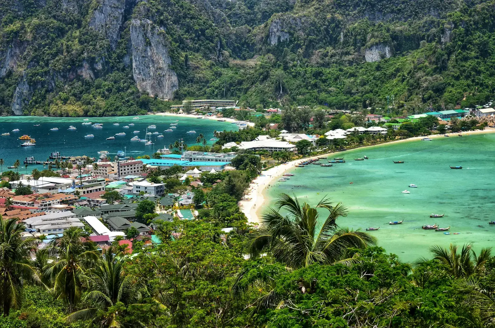Phi Phi Don village and its bays between green limestone hills in Krabi, Thailand