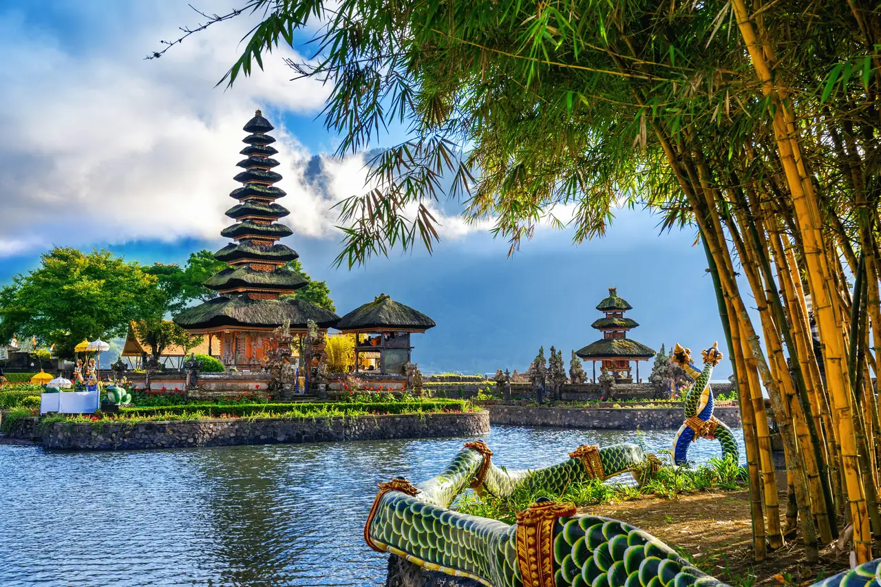 Pura Ulun Danu Bratan water temple on Lake Bratan in Bali framed by bamboo
