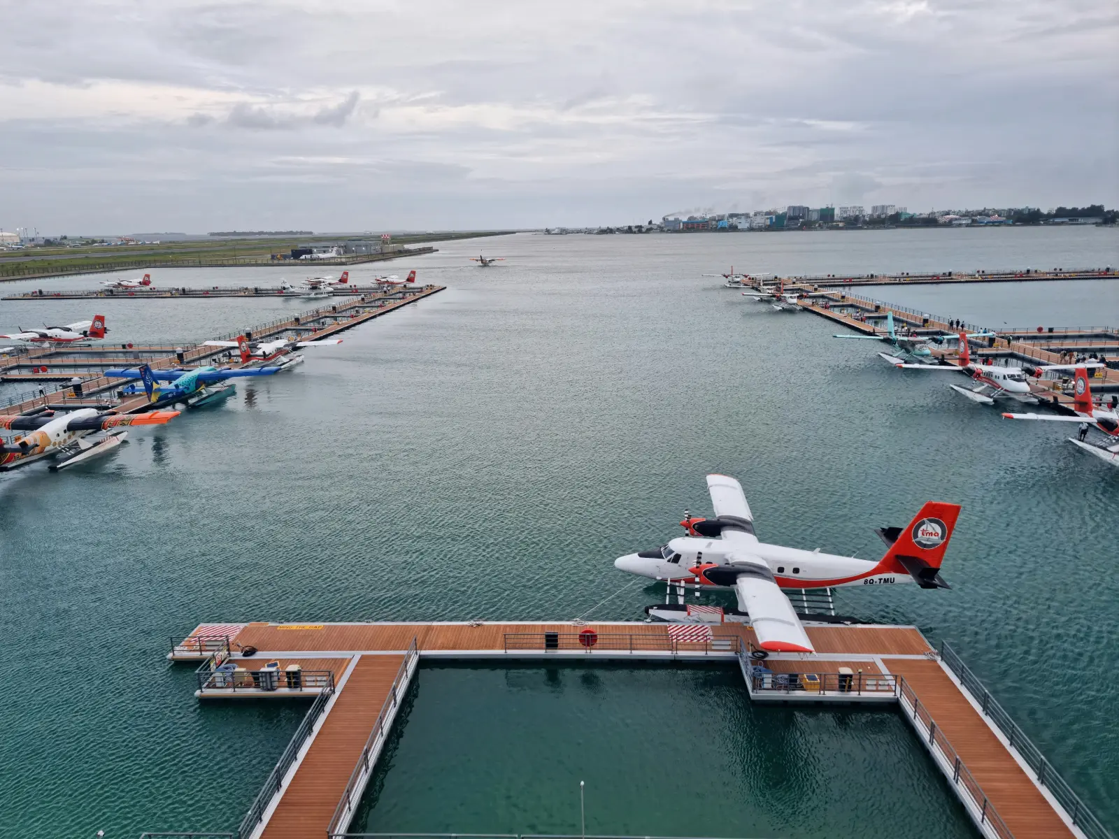 Seaplanes moored at the seaplane terminal beside the lagoon in Malé, Maldives