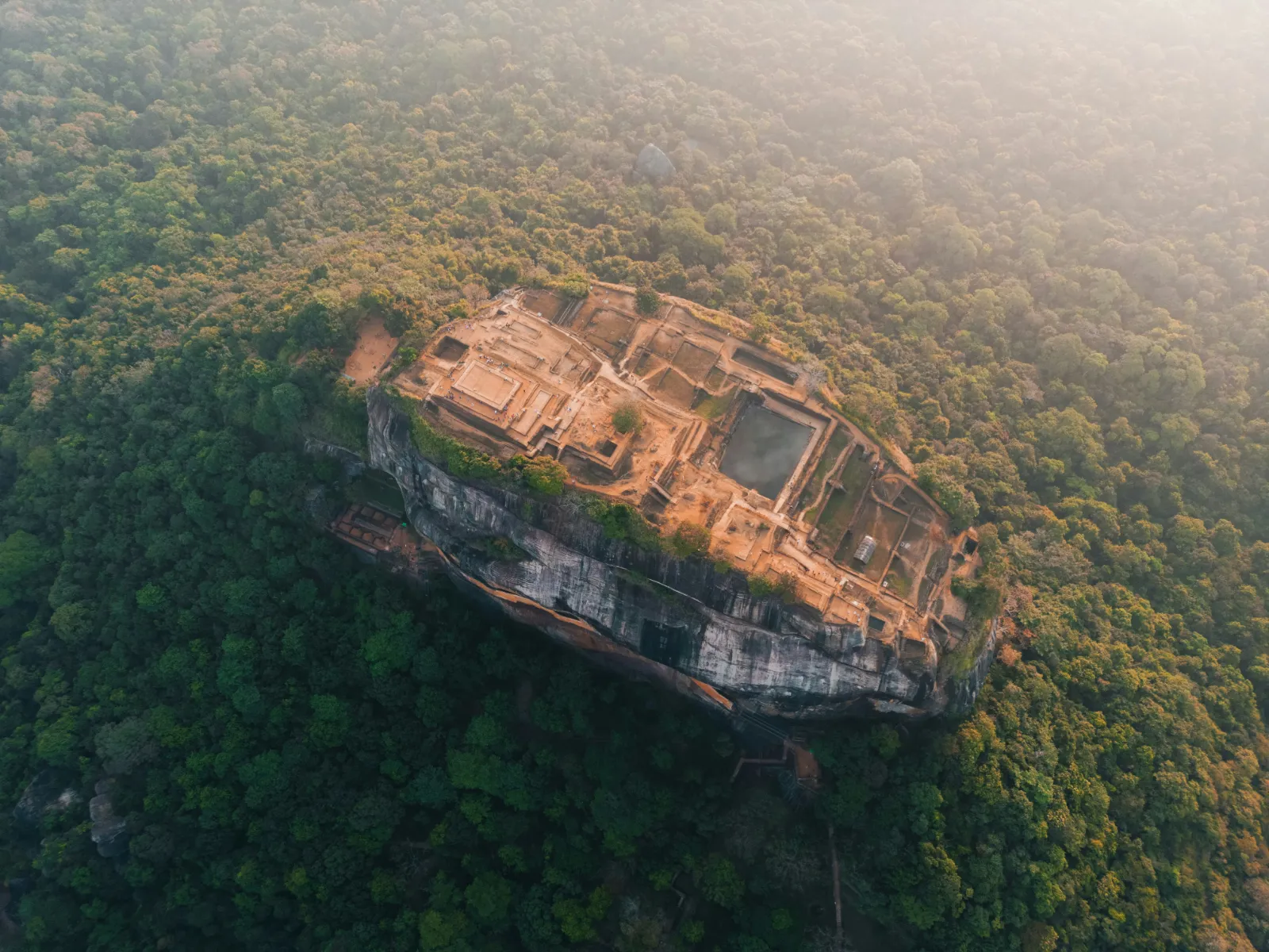 Aerial view of the brick palace ruins and terraces on the flat summit of Sigiriya rock