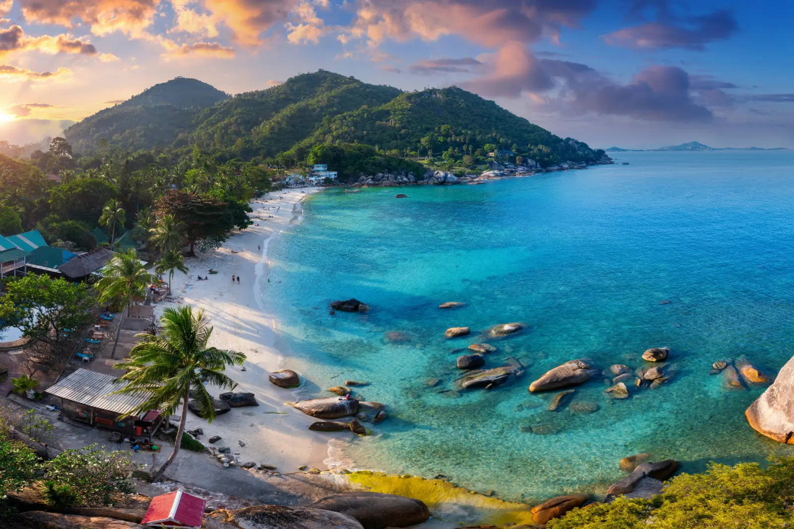 Silver Beach on Koh Samui with granite boulders and turquoise water at sunset
