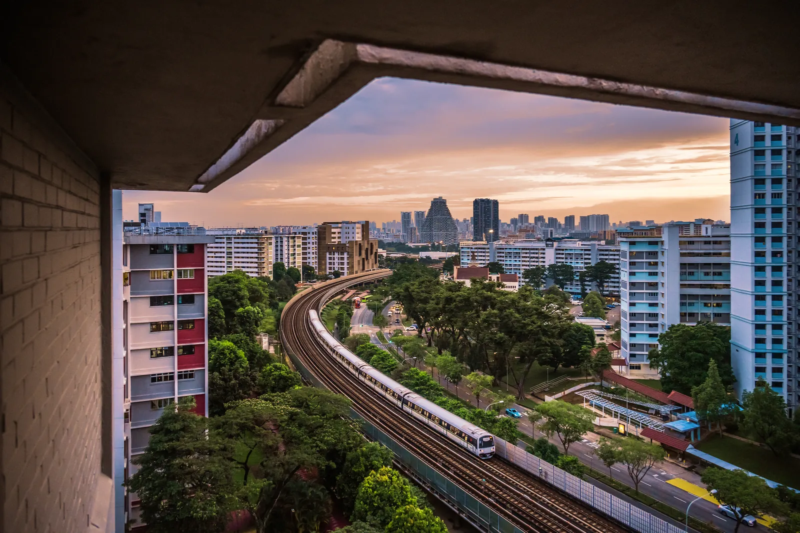 North South Line MRT tracks curving through Ang Mo Kio toward the Singapore skyline