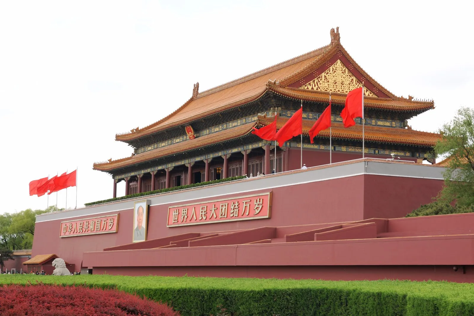 Tiananmen Gate of Heavenly Peace with red flags and its red walls in central Beijing