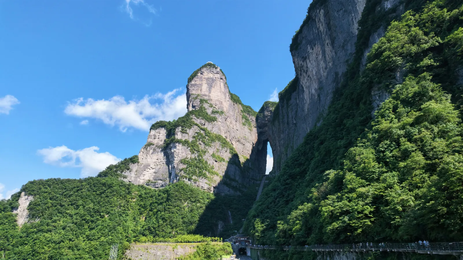 Green cliffs and peaks of Tianmen Mountain near Zhangjiajie under a clear blue sky
